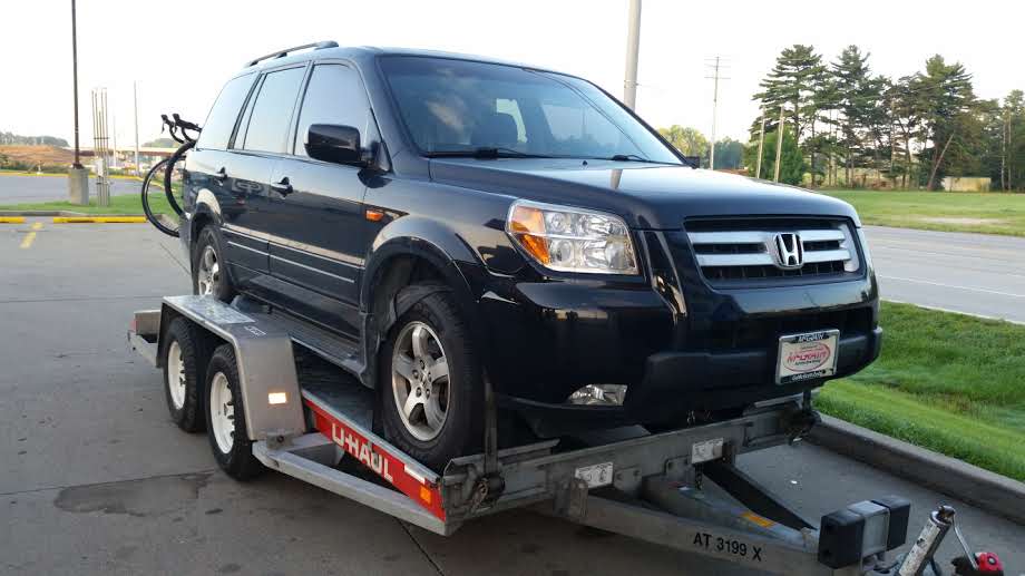 The Honda Pilot loaded on the U-haul trailer