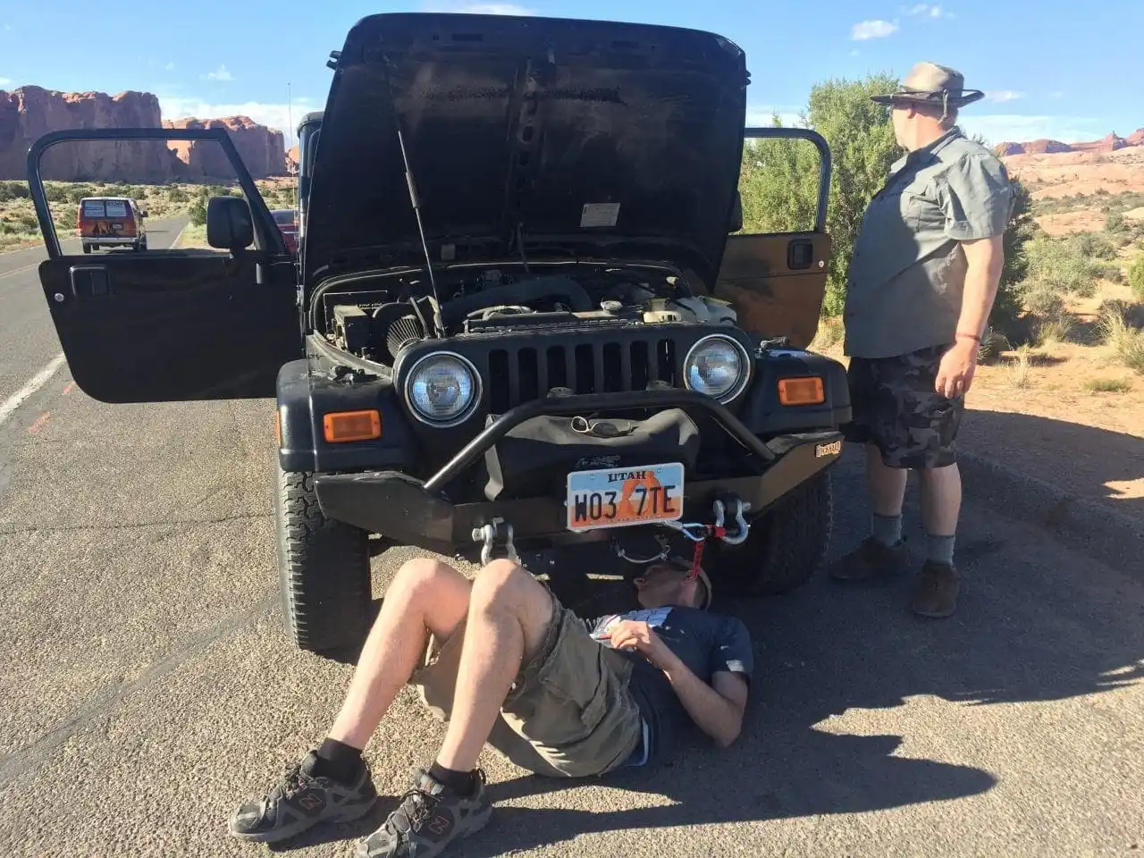 Keith working to repair the transmission line on the Jeep