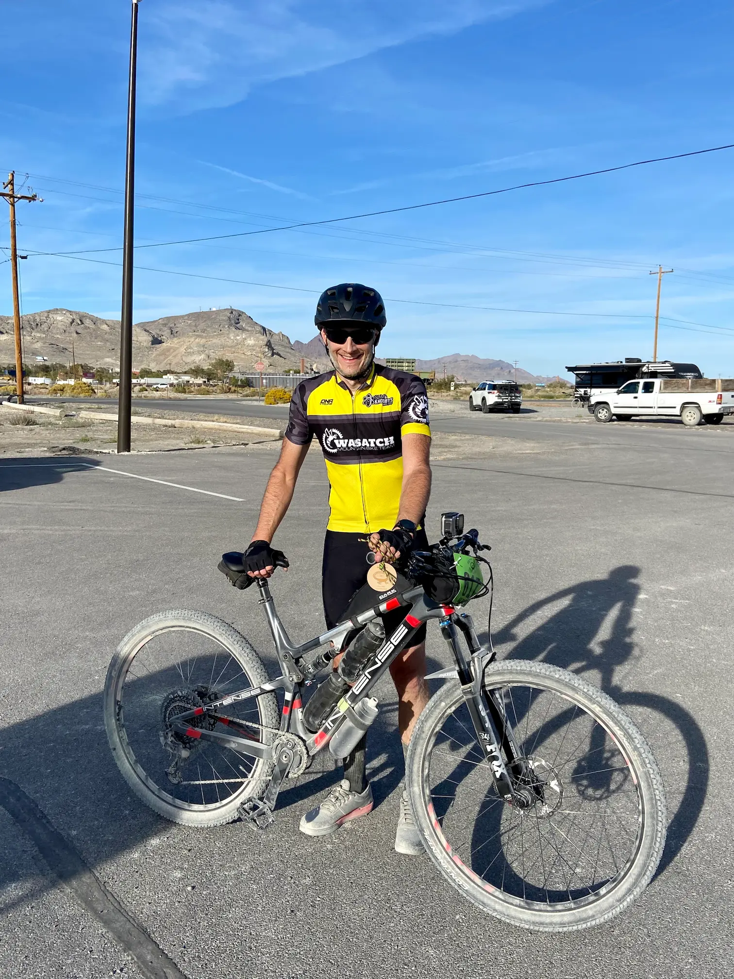 Keith is standing with his mountain bike after completing the Salty Lizard 100 gravel race