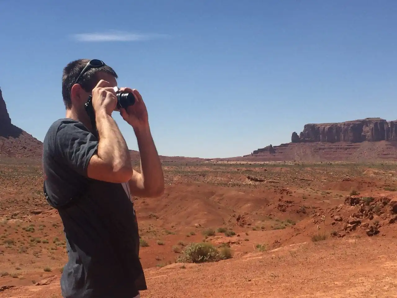 Keith is taking a photo at Monument Valley