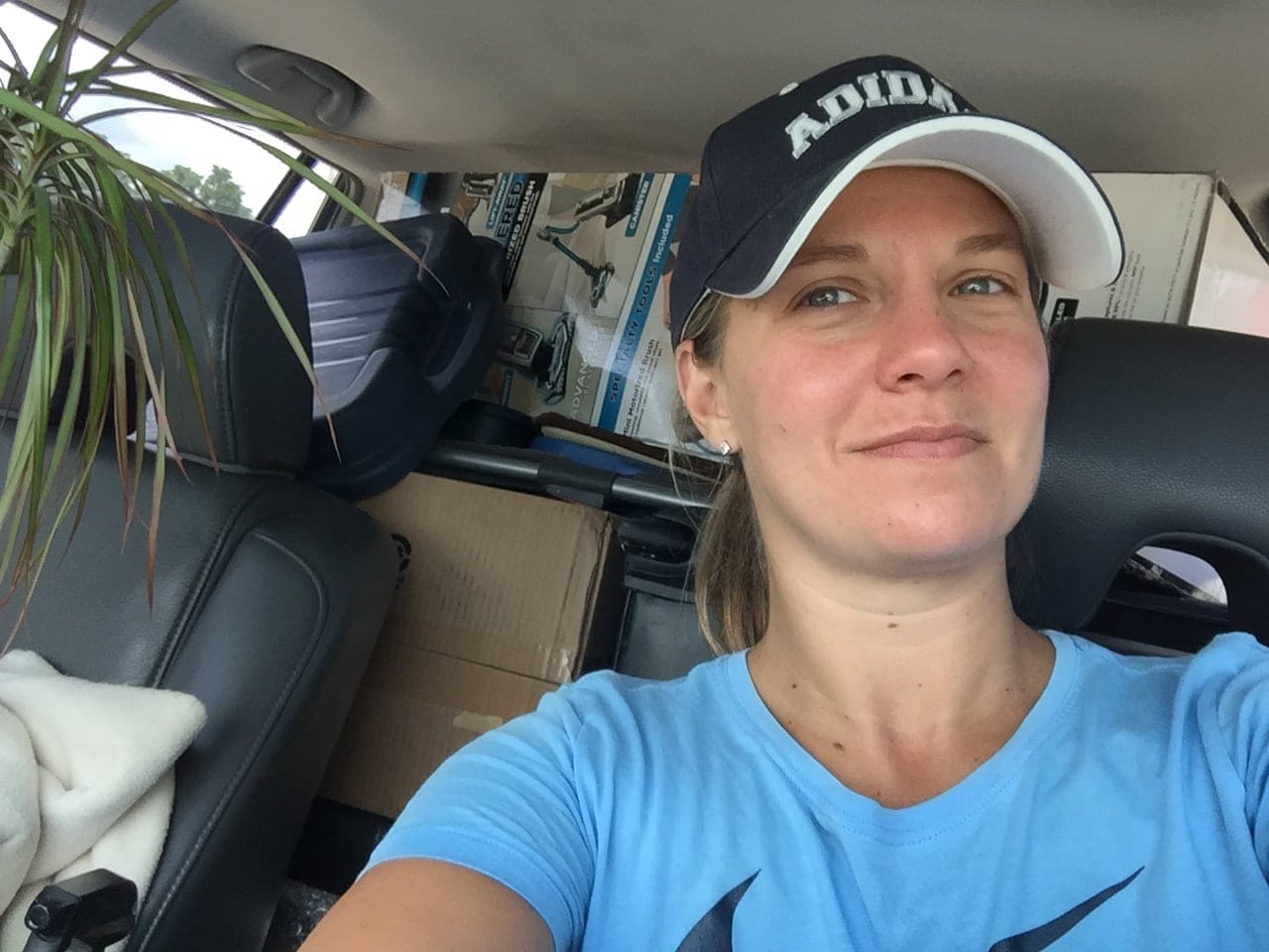 Lindsey in her car packed full of things to move to Utah