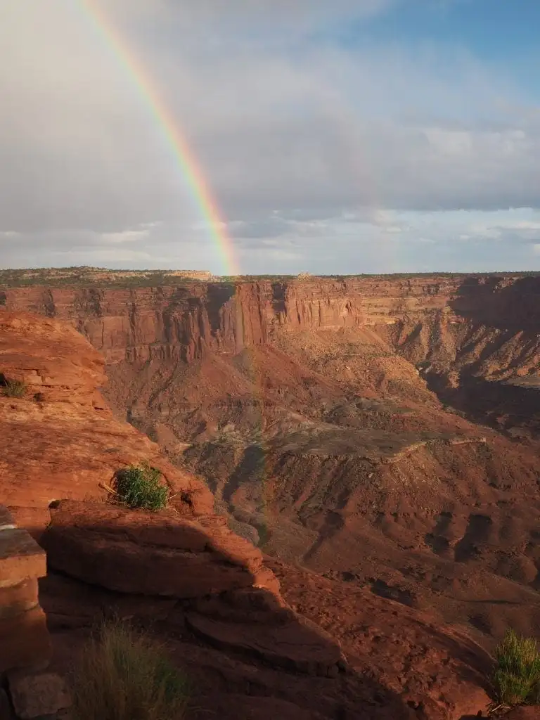 A double rainbow shining into the canyon at Canyonlands National Park