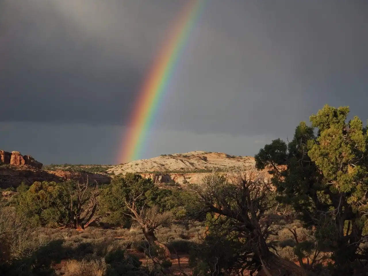 A rainbow shining over Canyonlands National Park