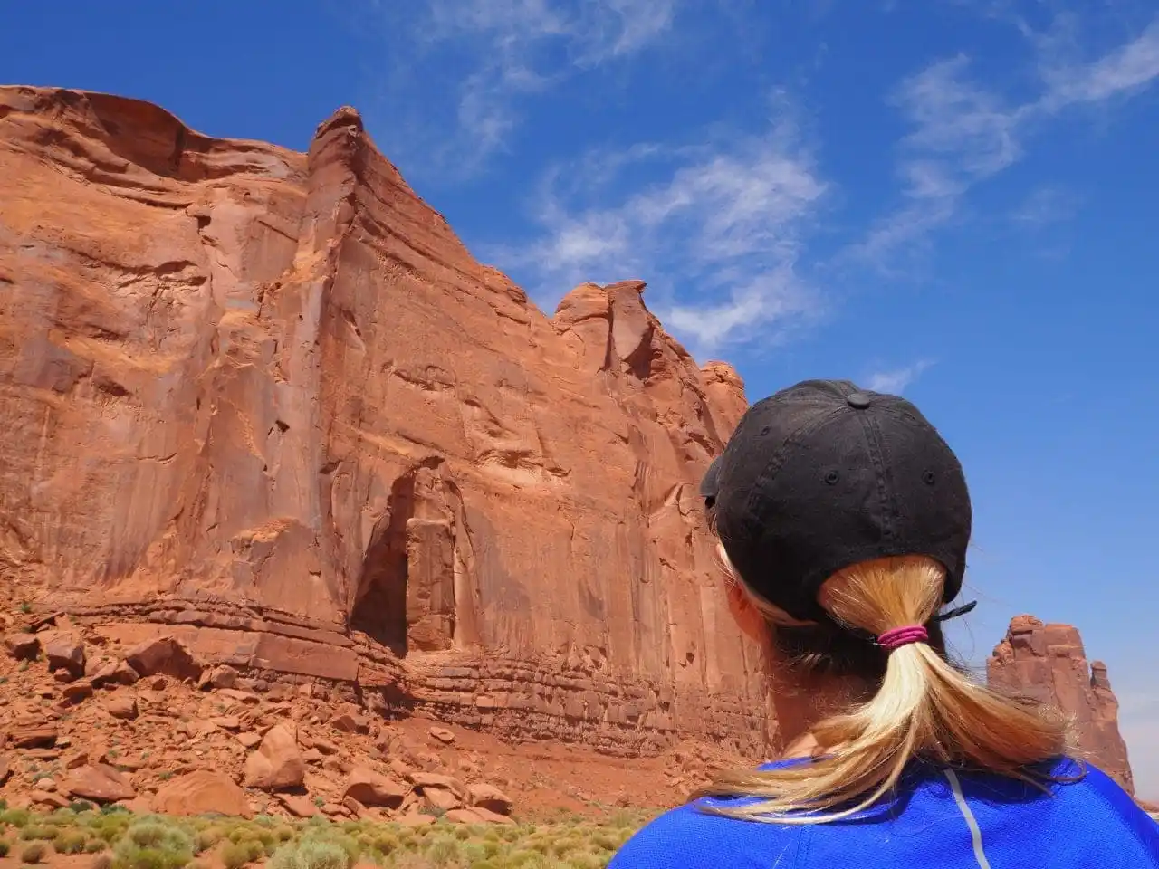 Lindsey is staring up at the massive rock walls