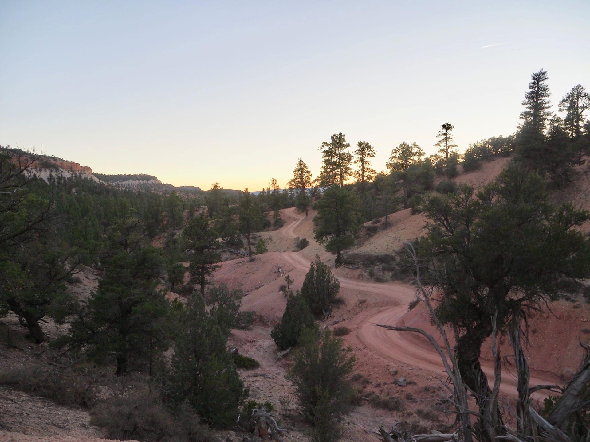 The trail winds through the desert near the Pink Cliffs