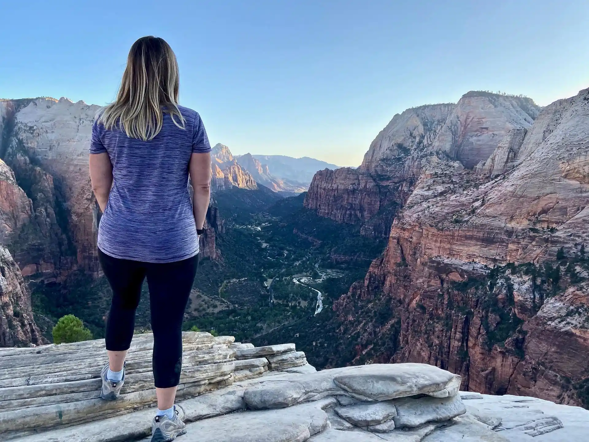 Lindsey is standing at the top of Angels Landing; taking in the incredible views