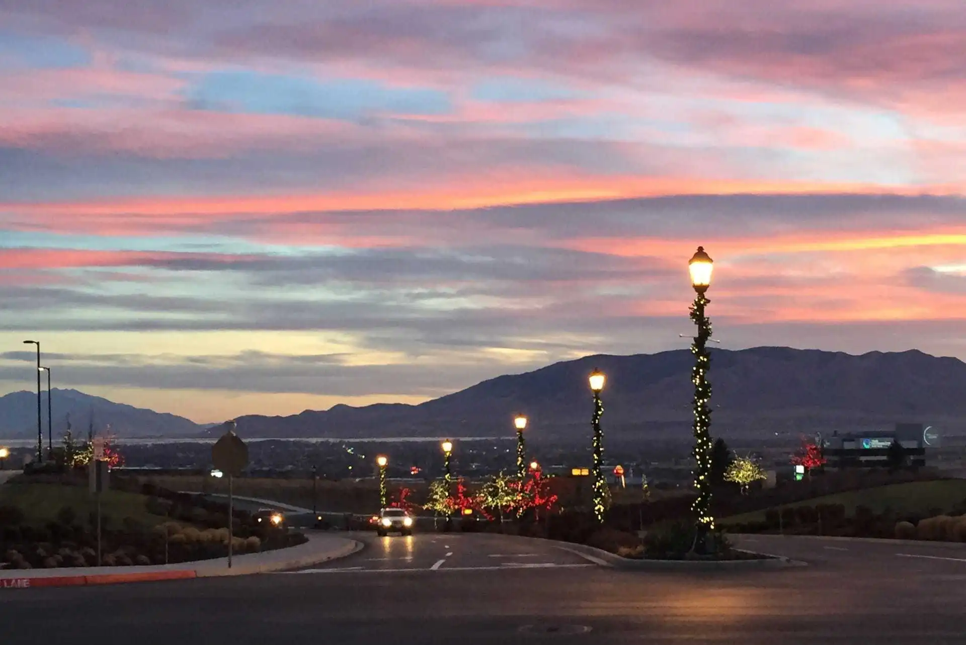 Sunset of Salt Lake valley with Christmas lights on the light poles