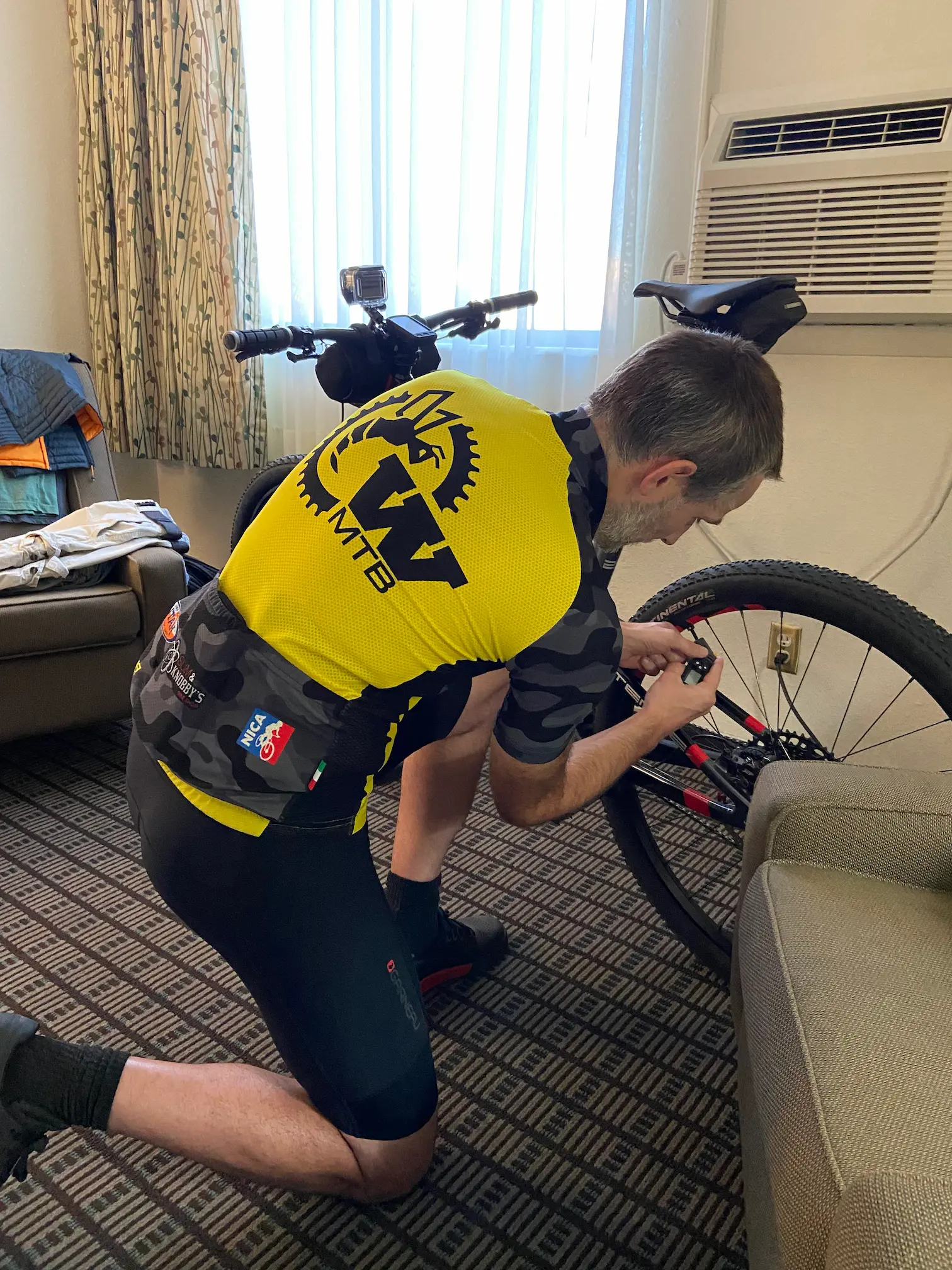 Keith is performing a basic bike check prior to the Salty Lizard 100 gravel race.