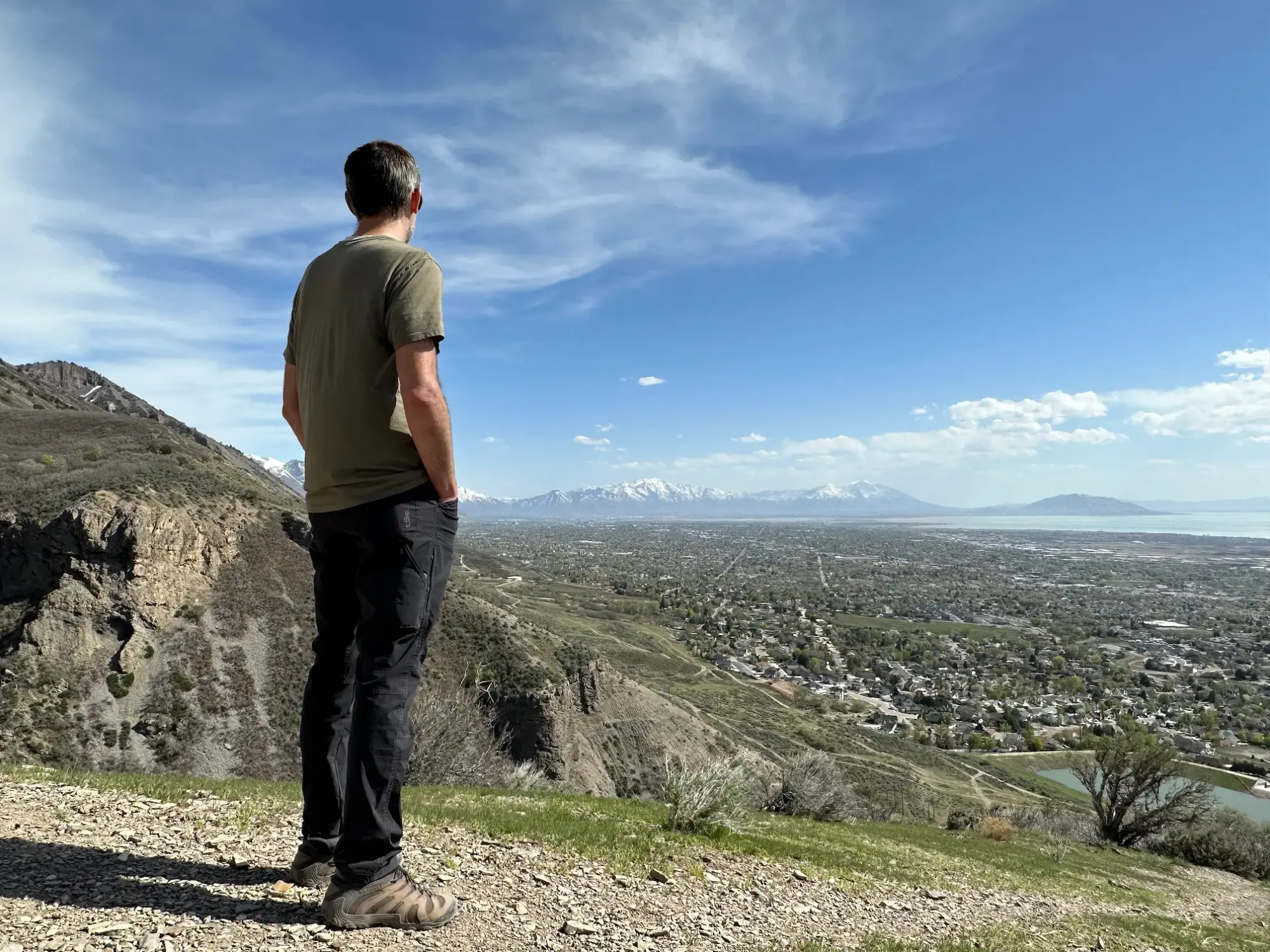 Keith is admiring the view of Utah Valley while hiking in Grove Creek Canyon.