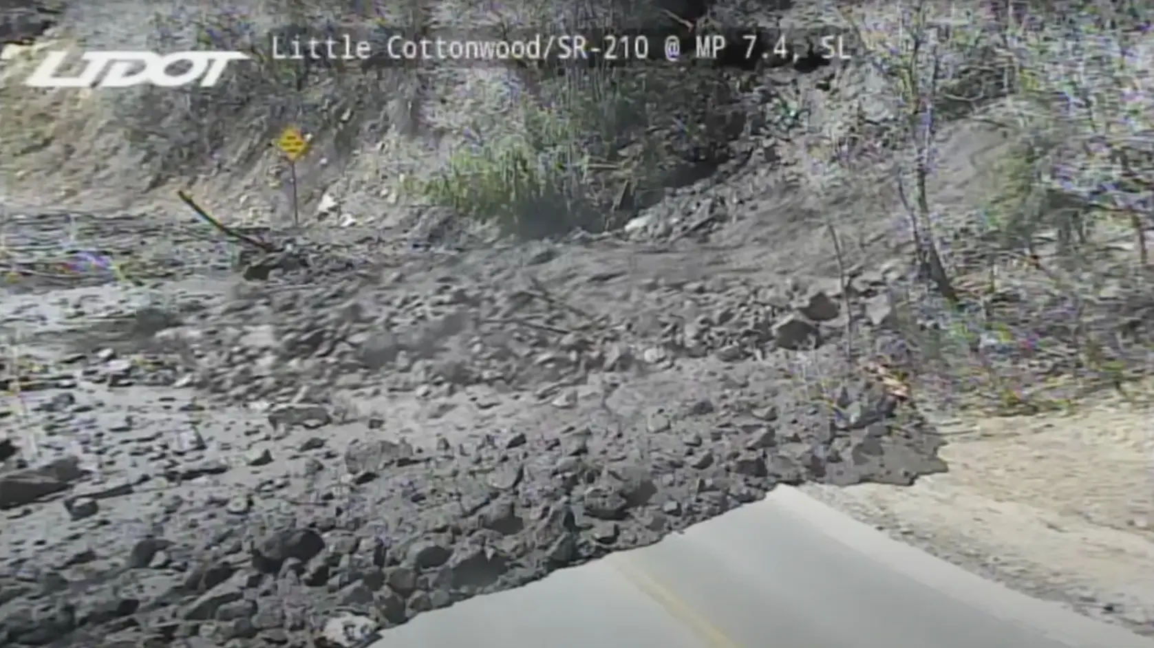 Screenshot from the UDOT video feed showing a mudslide crossing Little Cottonwood Canyon road