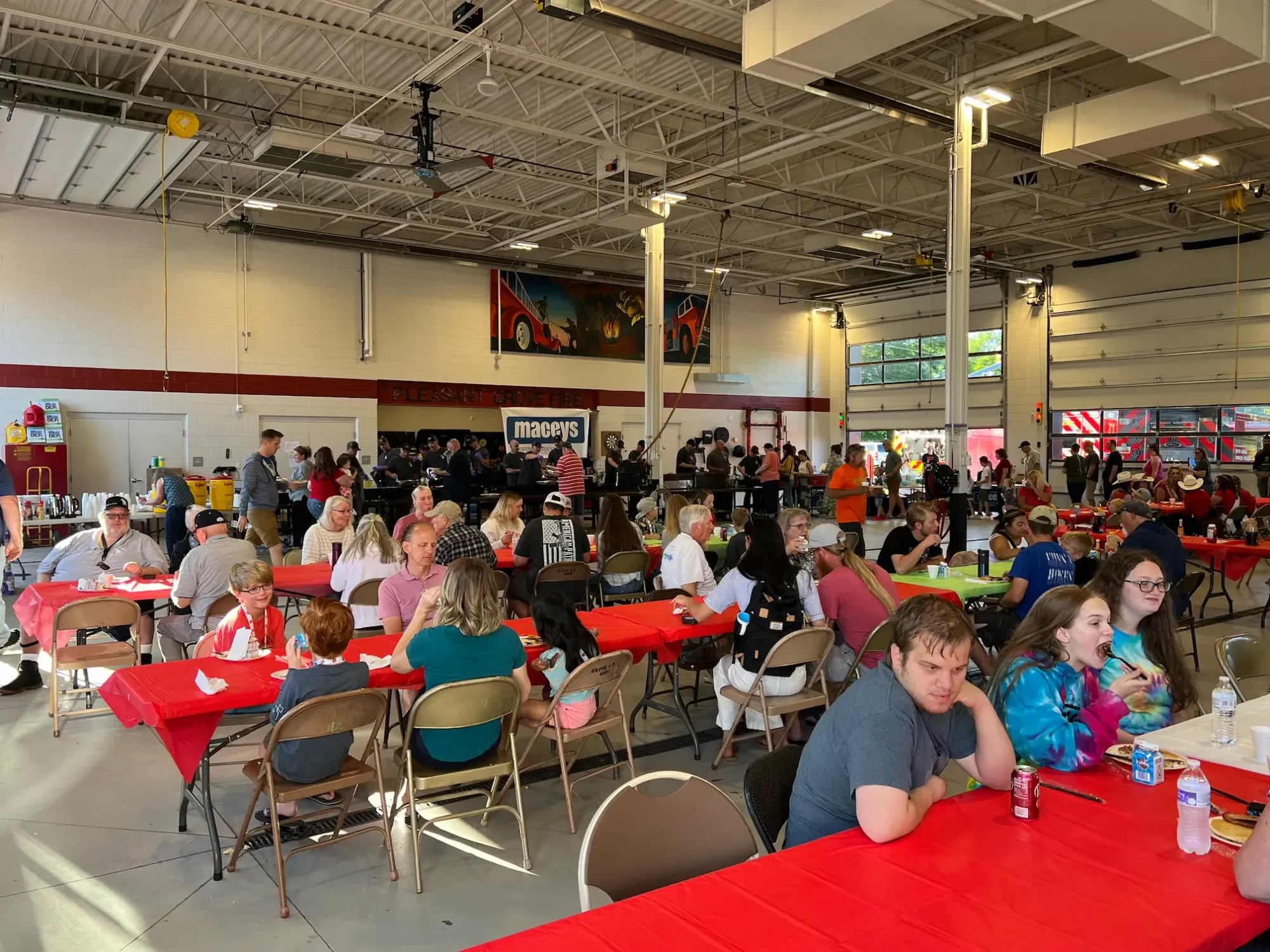 The Pleasant Grove Firehouse is packed with people supporting their annual pancake breakfast