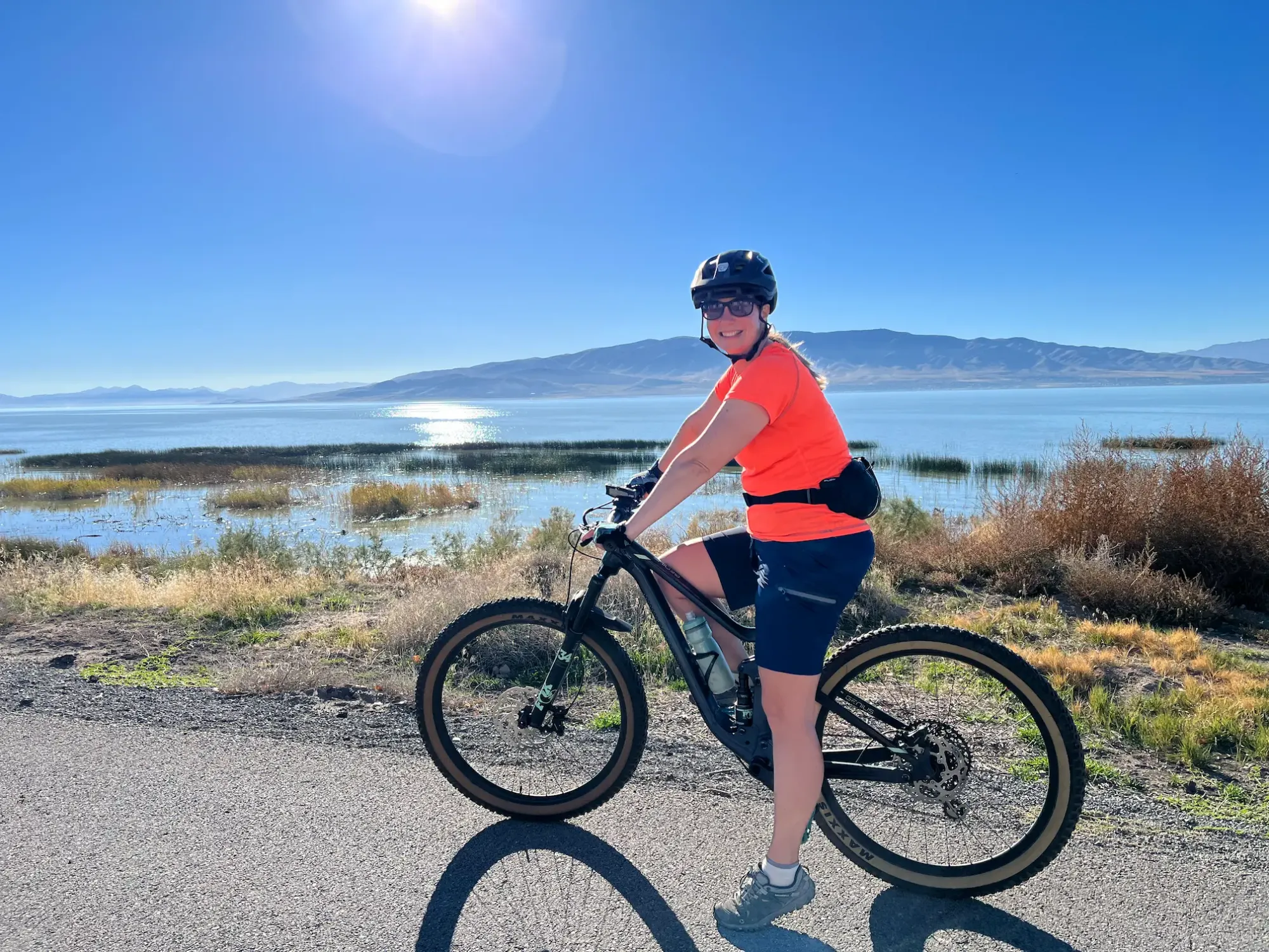 Lindsey is riding her bike along the Utah Lake Shoreline trail