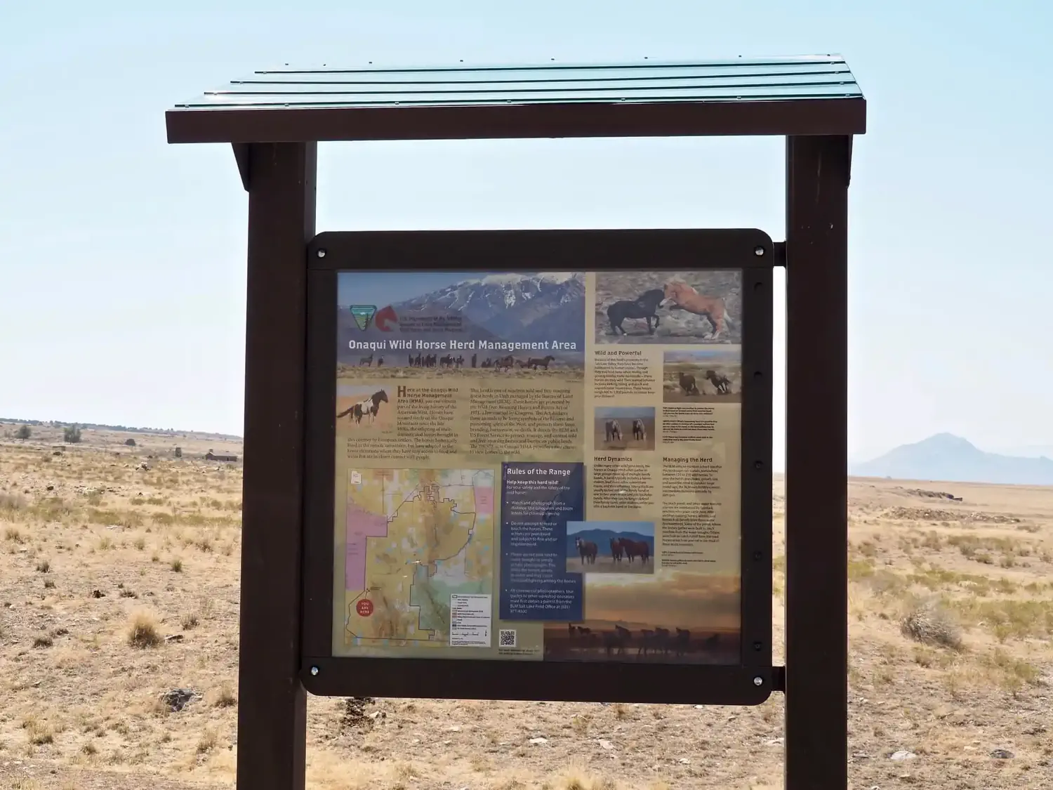 A trail sign describing the groups of wild horses in the area