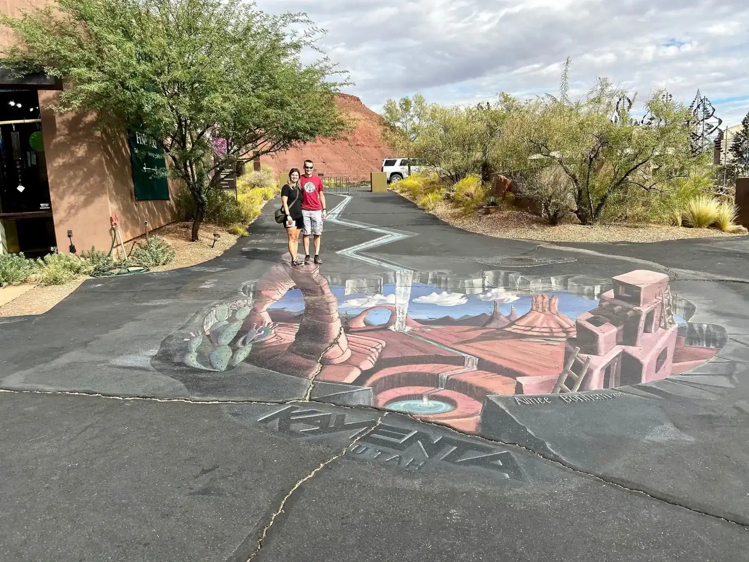 We are standing on top of the Delicate Arch within a 3D illusion painting