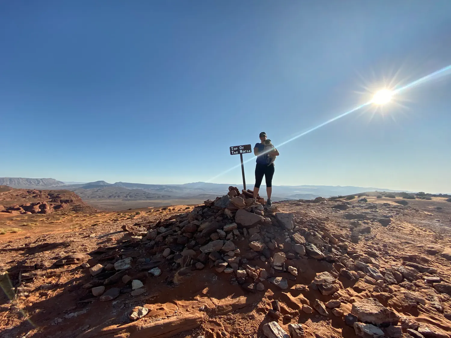 Lindsey and Lexi are standing at the "Top of the World" on our route