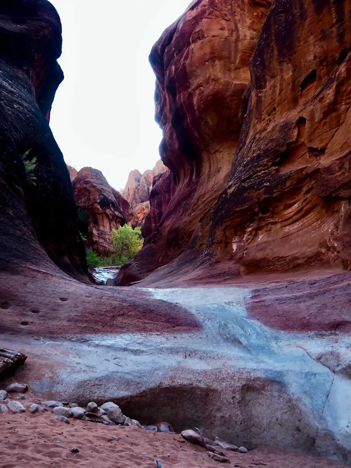 The water has polished the sandstone such that it is slick to walk on