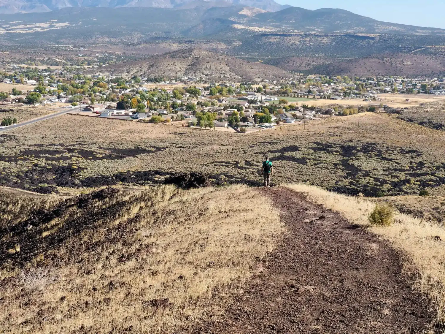 Keith is walking along the rim of the cinder cone as we prepare to descend into it