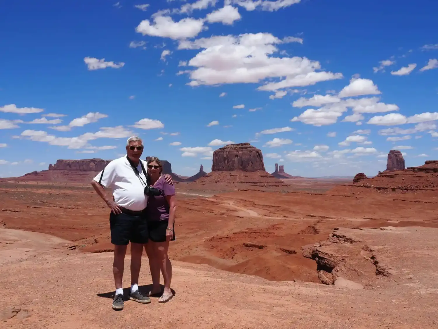 Marilyn and John posing for a photo at Monument Valley