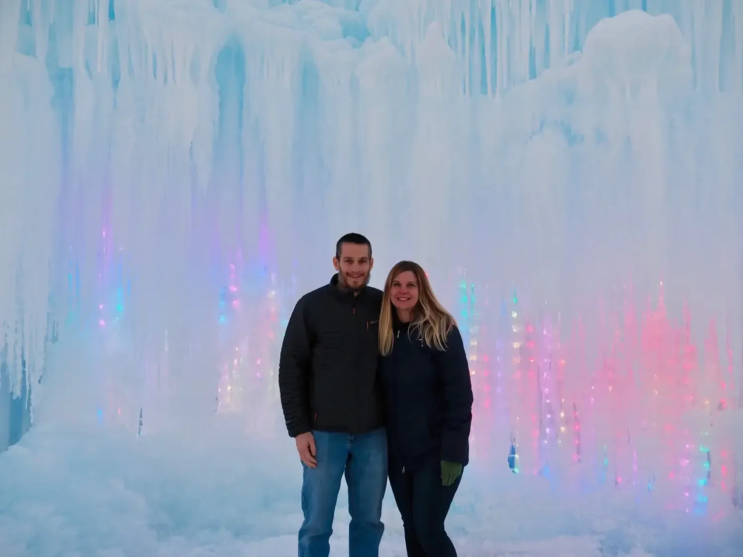 Keith and Lindsey standing in front of a huge ice castle