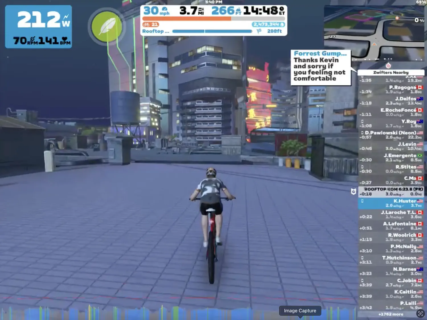 Keith is riding through a virtual city during one of his recent Zwift training rides