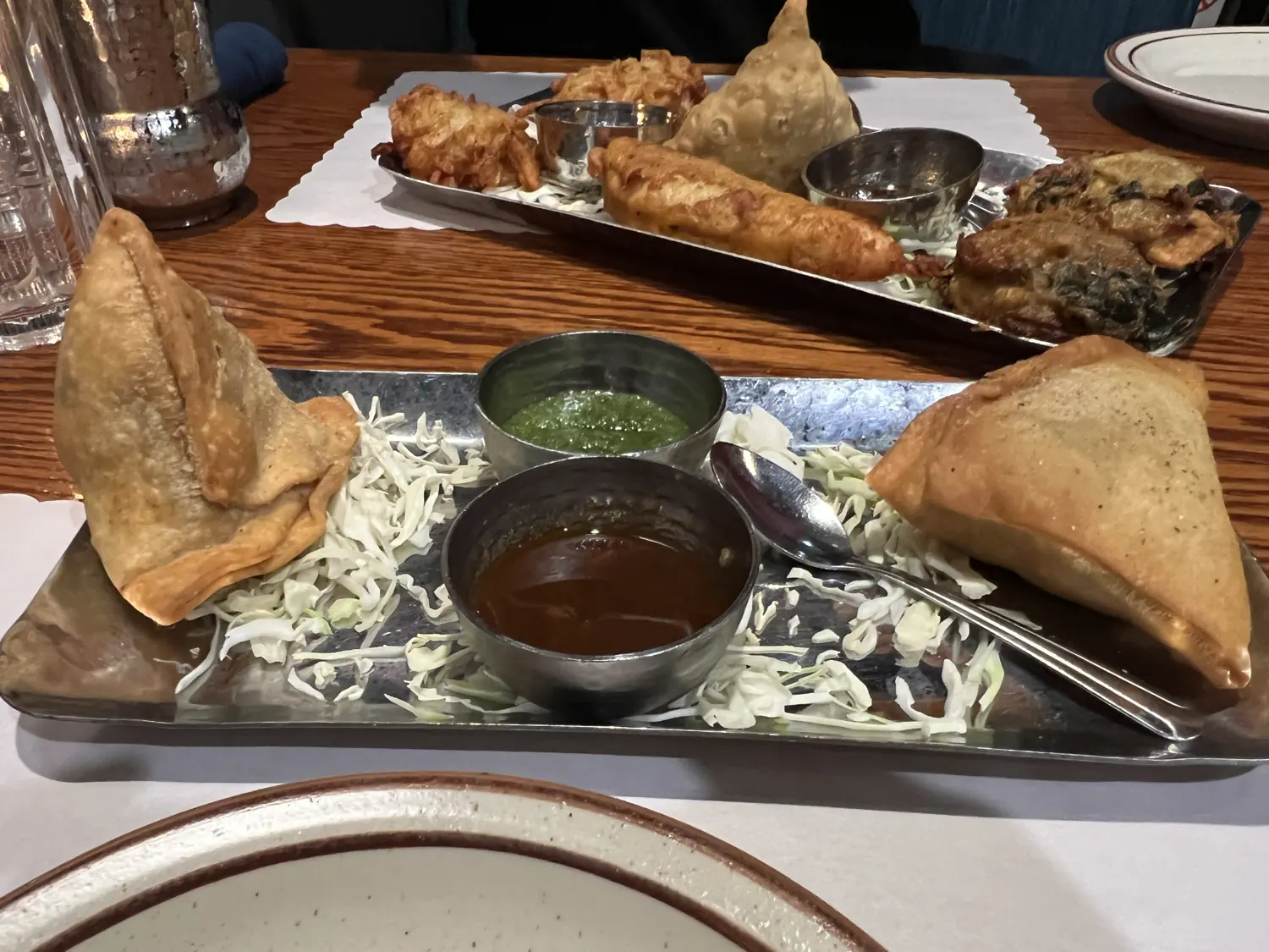 We ordered an assortment of appetizers to start our meal: Vegetable Samosas, Onion Bhaji, Chicken Pakora, and Vegetable Pakora