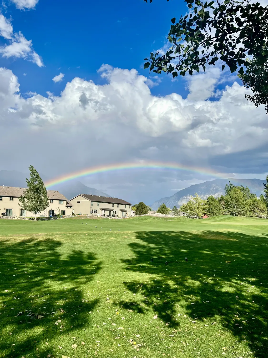 Storm over the Wasatch Mountains with a rainbow. This is the view from our house.