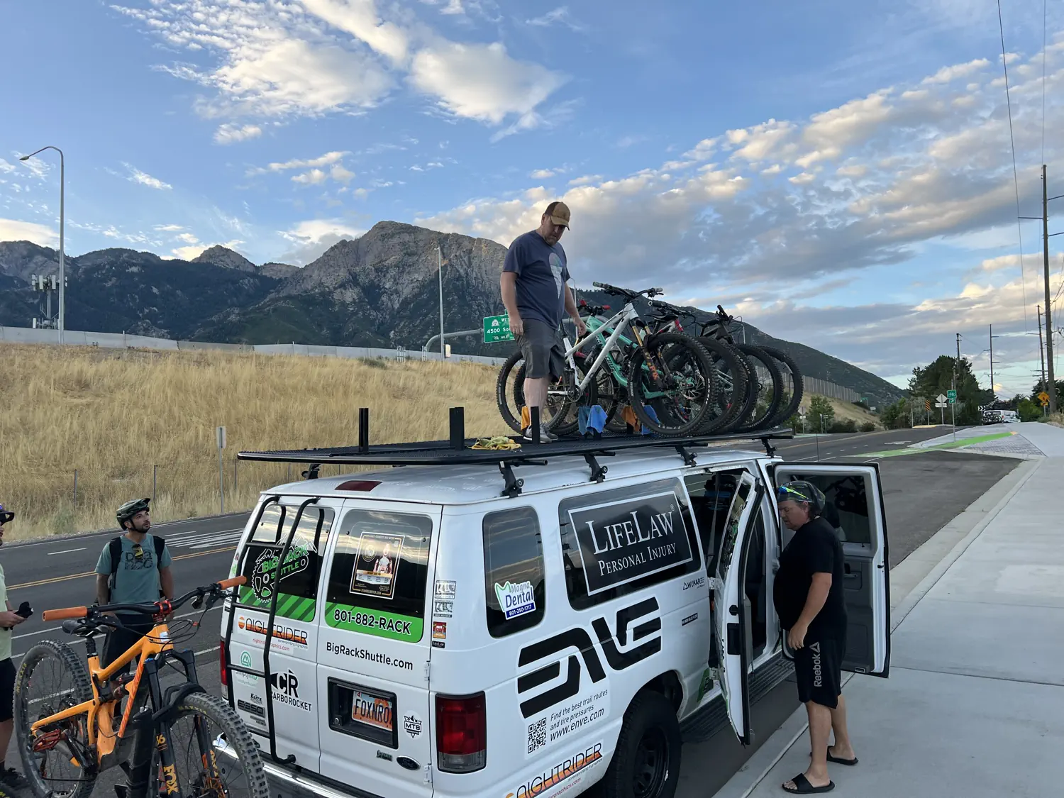 Bikes are being loaded onto the Big Rack Shuttle van