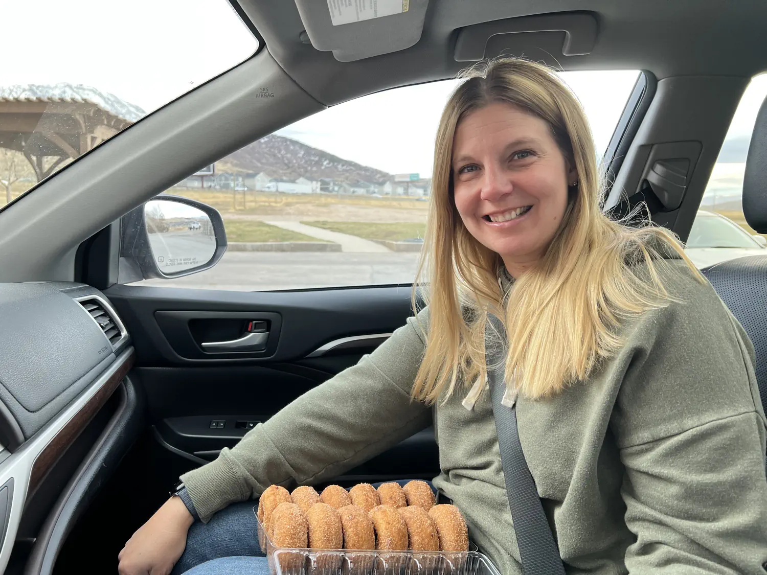 Lindsey is smiling as we prepare to chow down on the apple cider donuts from Rowley's Red Barn in Santaquin, UT