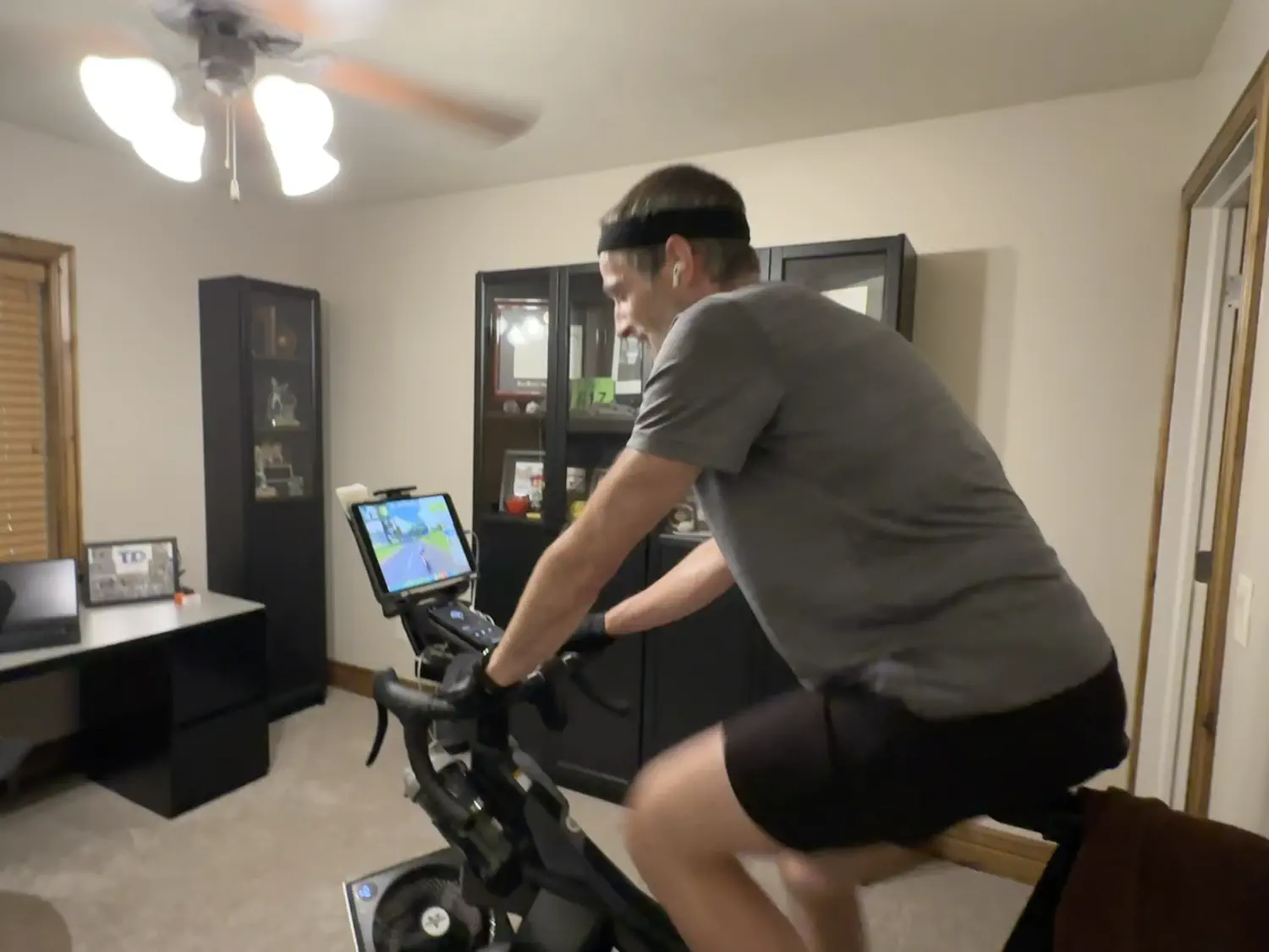 Keith is riding a Zwift virtual training course on his Stages SB20 indoor bike trainer