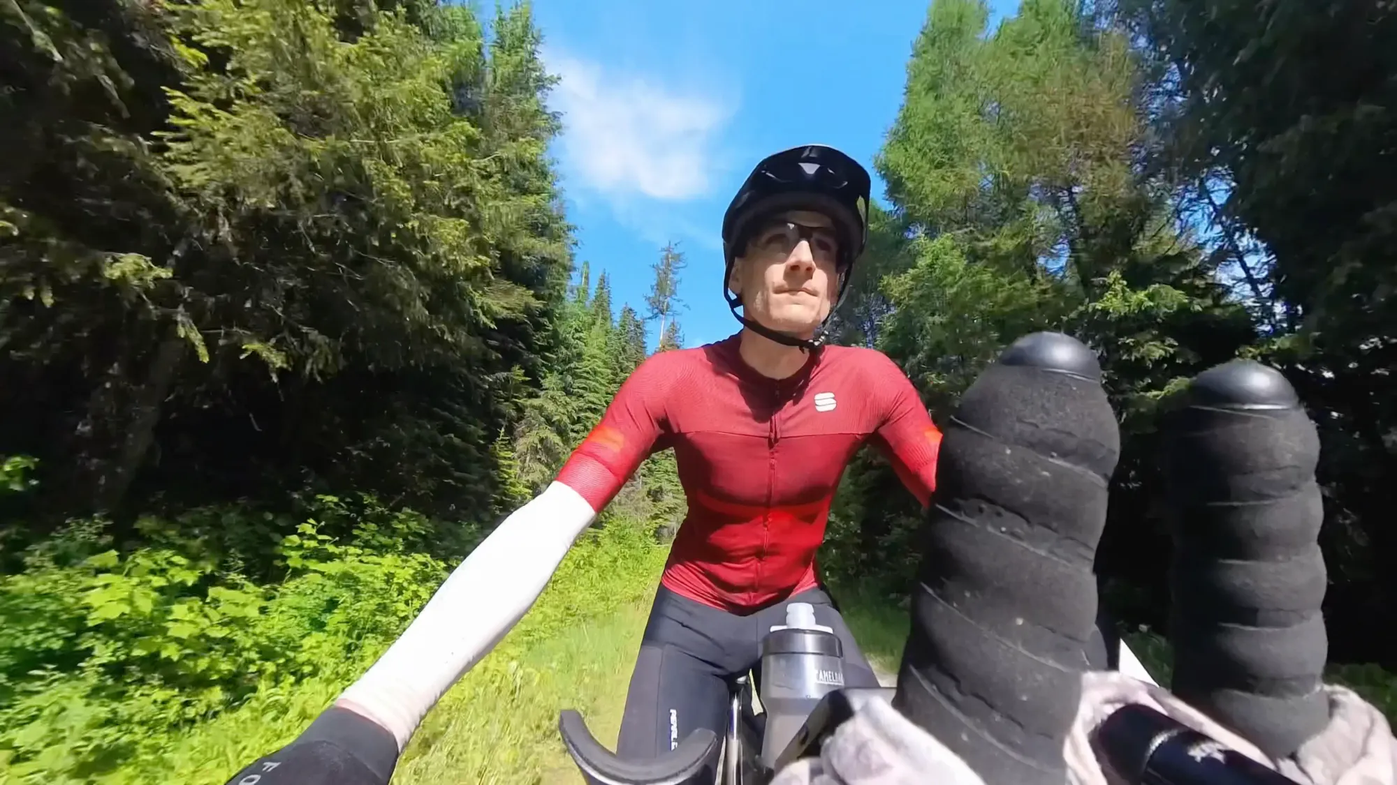 Keith is riding the first short descent of the day