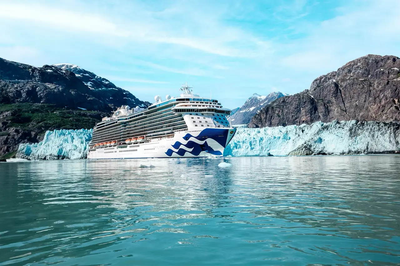 Stock photo of an Alaskan cruise ship in front of a glacier (source: Princess.com)